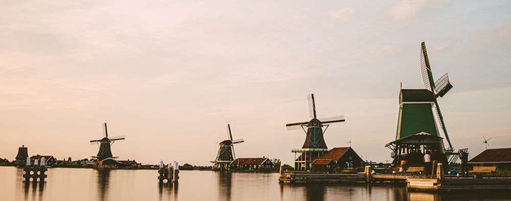 Traditional Dutch windmills beside the water near Amsterdam.
