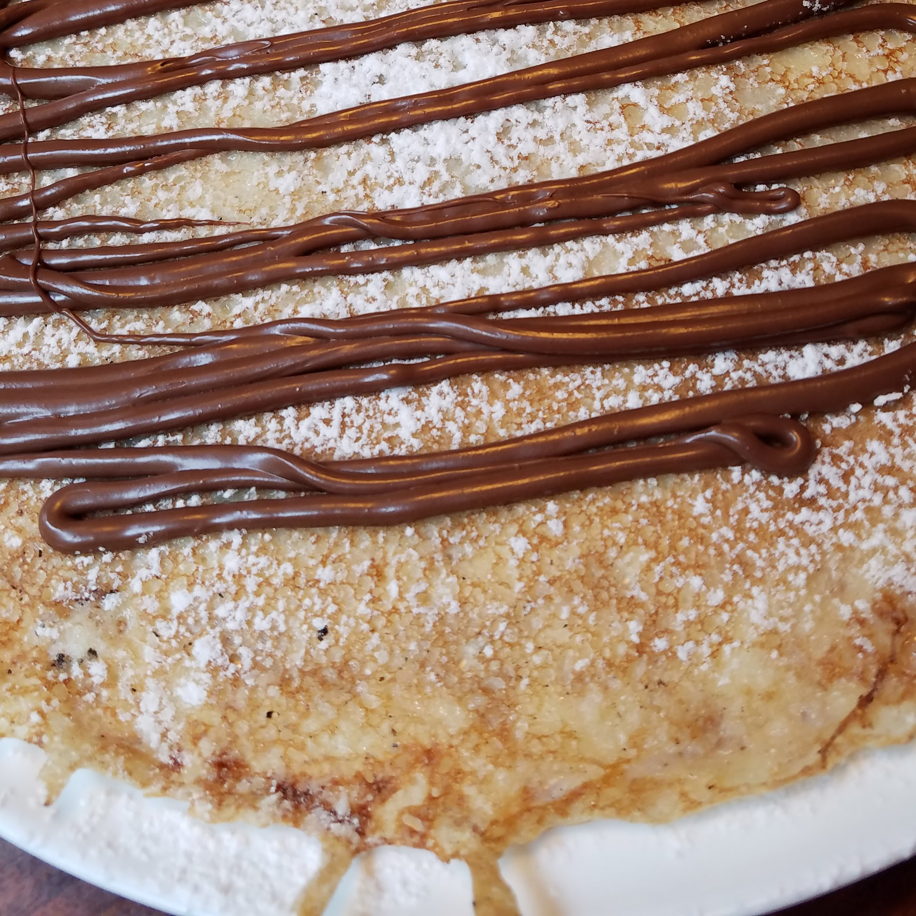 A canal-side scene in Amsterdam with historic buildings and water.