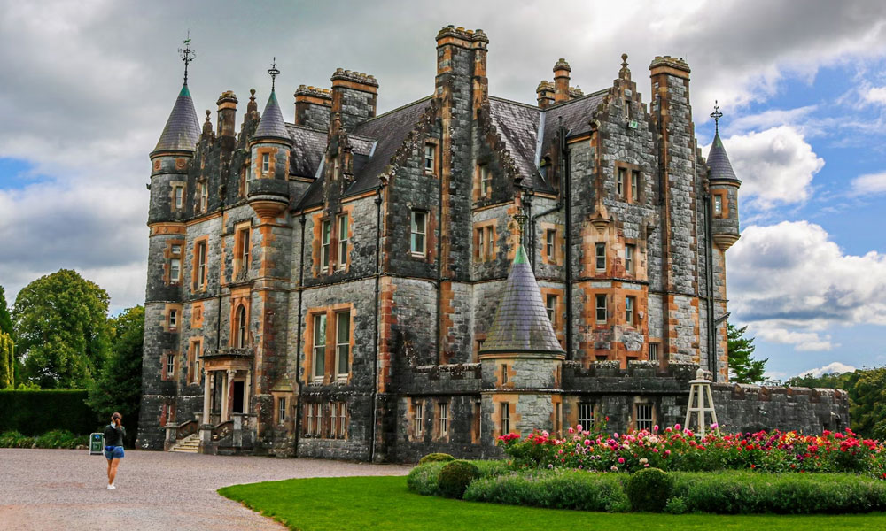 Blarney Castle surrounded by greenery in Ireland.