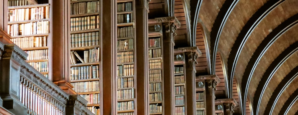 Tall bookshelves inside Trinity College's Old Library.