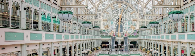 An ornate glass-roofed interior arcade in Dublin.