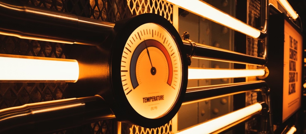 A large clock hangs above windows inside the Guinness Storehouse in Dublin.