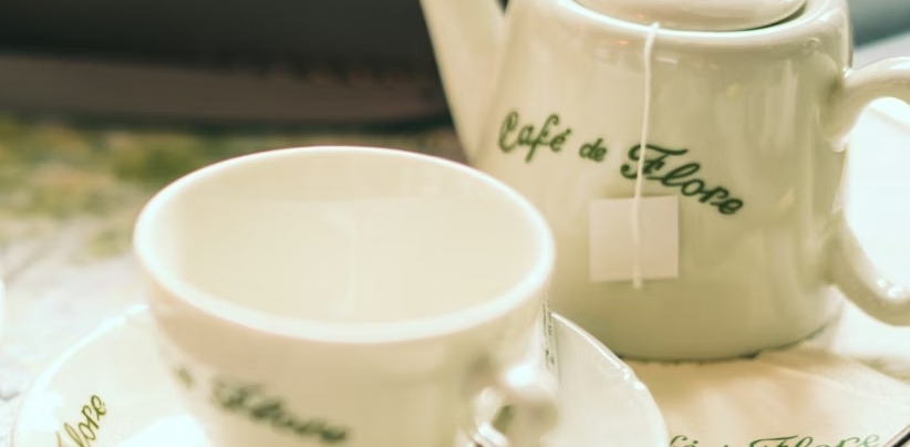 A teacup and teapot on a Cafe de Flore table in Paris.