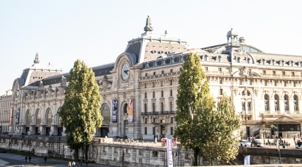 The exterior of the Orsay Museum beside the Seine in Paris.