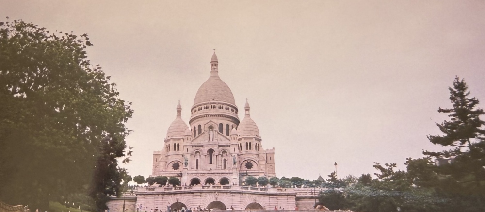 Sacre-Coeur Basilica rising above the hill in Montmartre.