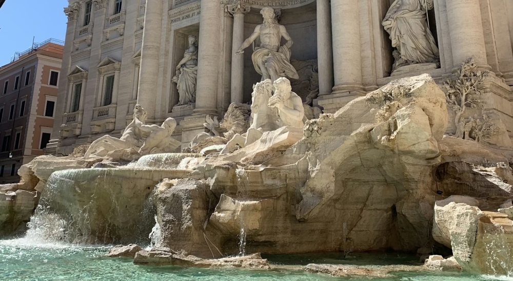 Statues and cascading water at the Trevi Fountain.