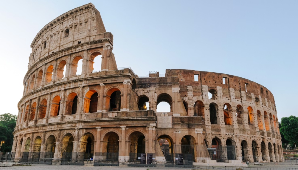 The exterior arches of the Colosseum at dusk.