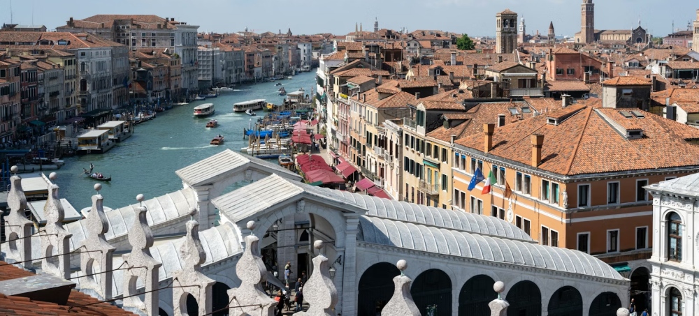 A rooftop view over the Rialto Bridge and Grand Canal.
