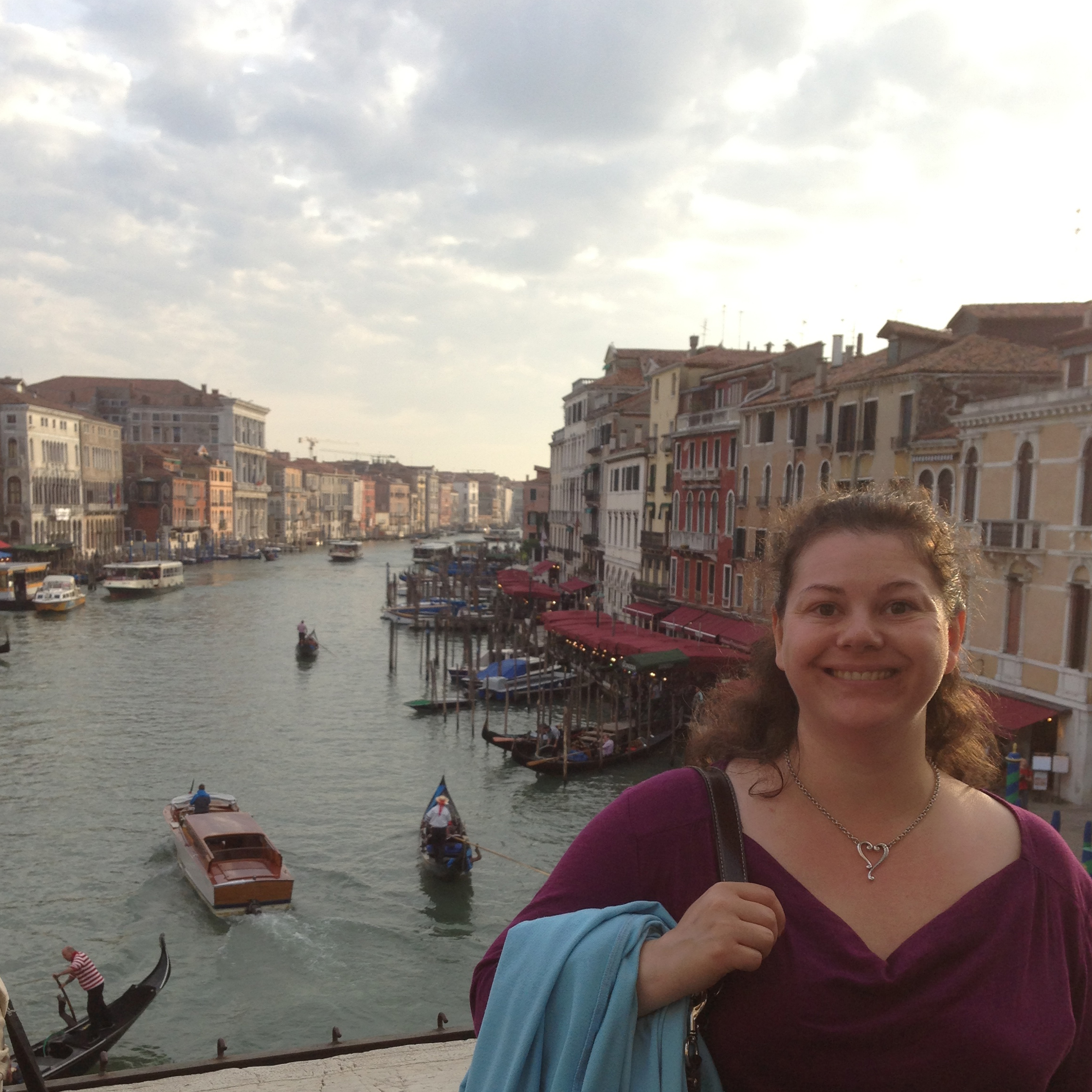A canal scene in Venice with bridges and buildings.